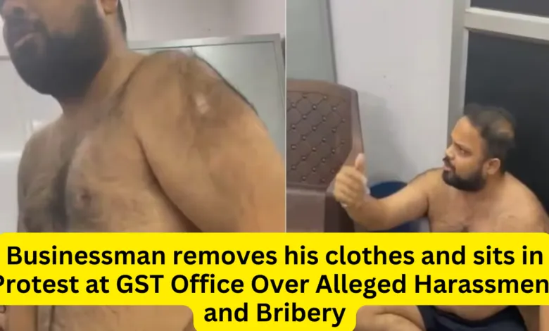 Businessman removes his clothes and sits in Protest at GST Office Over Alleged Harassment and Bribery