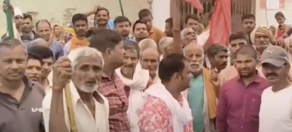 Villagers protesting in Nahi Jyuniyan village in Kanpur Dehat against transfer of Bank of Baroda Branch