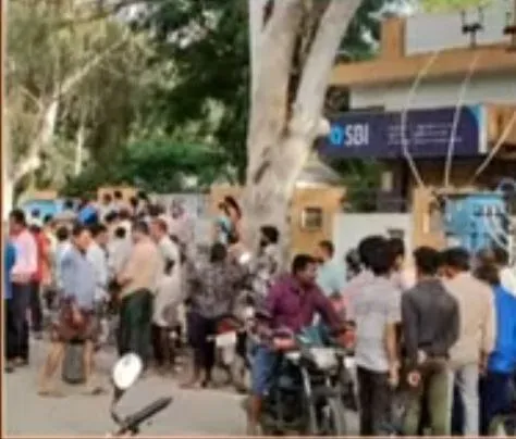 Customer gather outside SBI Hindupur Andhra Pradesh