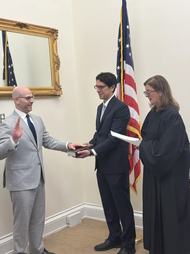 Judge Elizabeth L. Branch swears in Stephen I. Miran on September 16, 2025, as a member of the Board of Governors of the Federal Reserve System.
