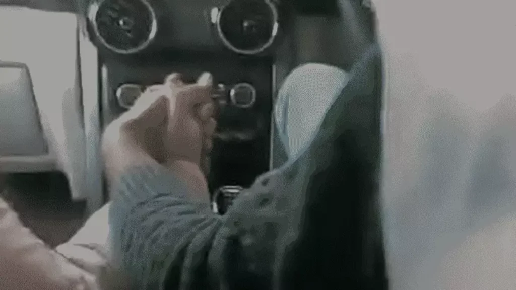 Bank Officer Travelling in Car with his Colleague