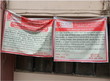 Flex Banner announcing Bank of Baroda Branch Manjhanpur will be shifted to new premises