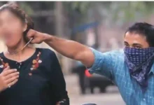 Man snatching chain from woman walking on road