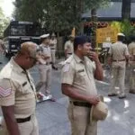 Four people have been arrested in Bengaluru for allegedly stripping and assaulting a woman over non repayment of loan.