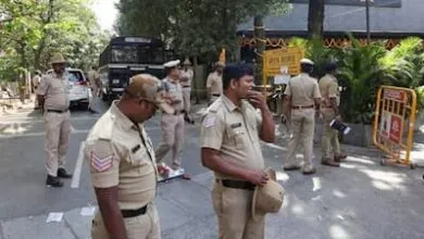 Four people have been arrested in Bengaluru for allegedly stripping and assaulting a woman over non repayment of loan.